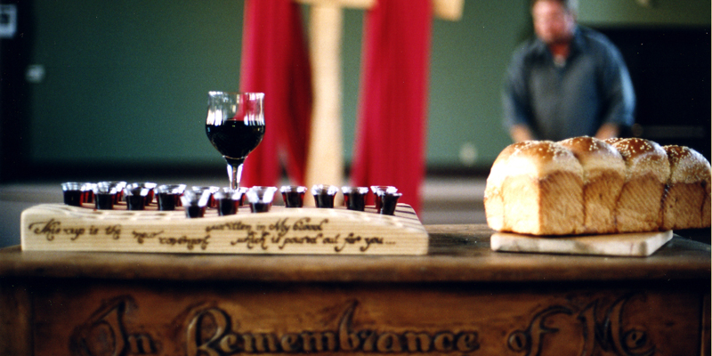 Close up of alter with wine and bread displayed