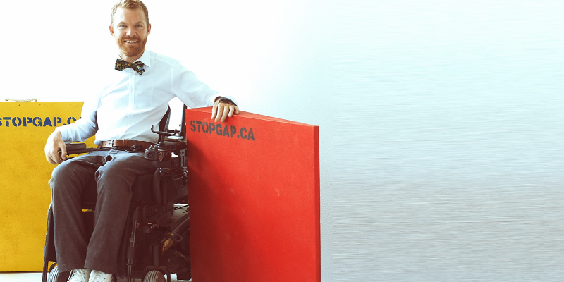 Head shot of Luke Anderson, Founder and Executive Director of StopGap Foundation in his wheelchair