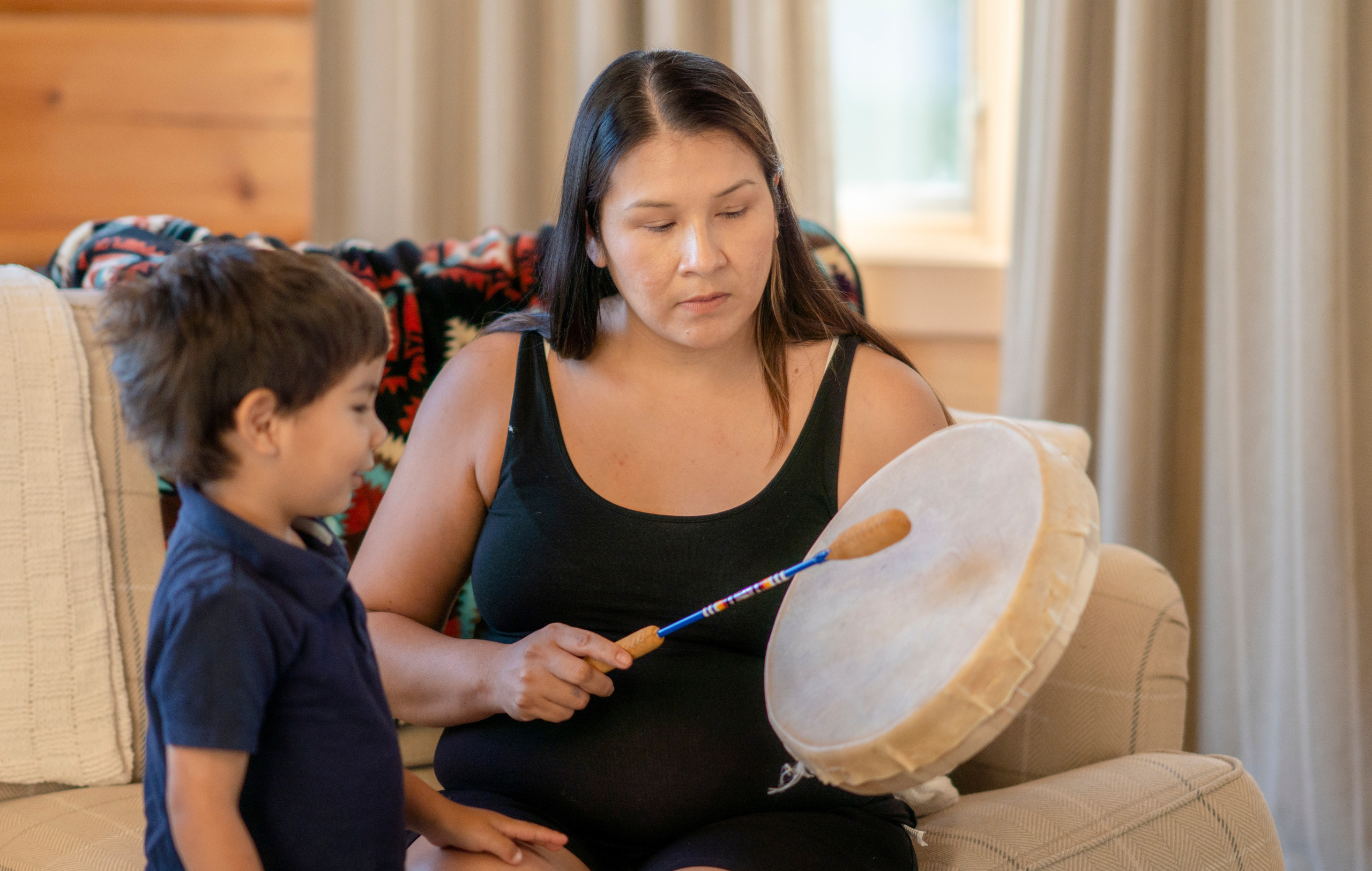 Indigenous Cultural Resurgence - Woman playing drum